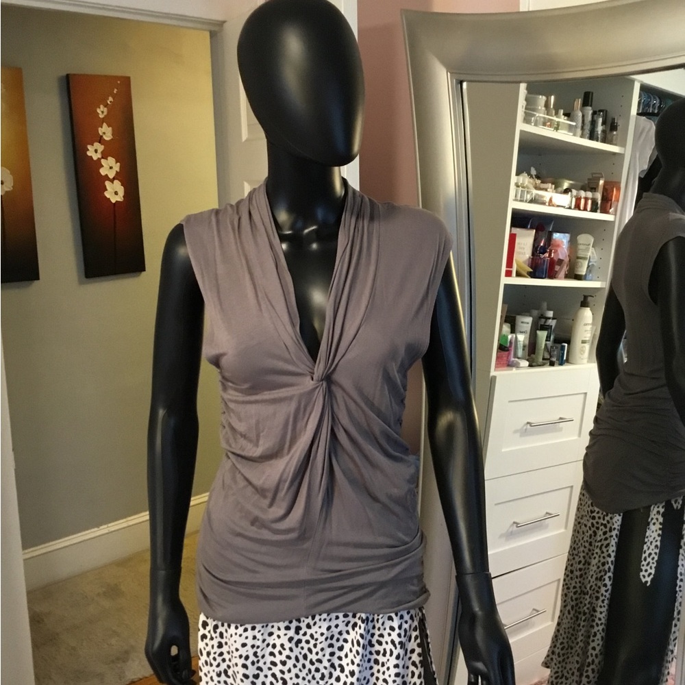 Gray sleeveless top with front knot design at chest